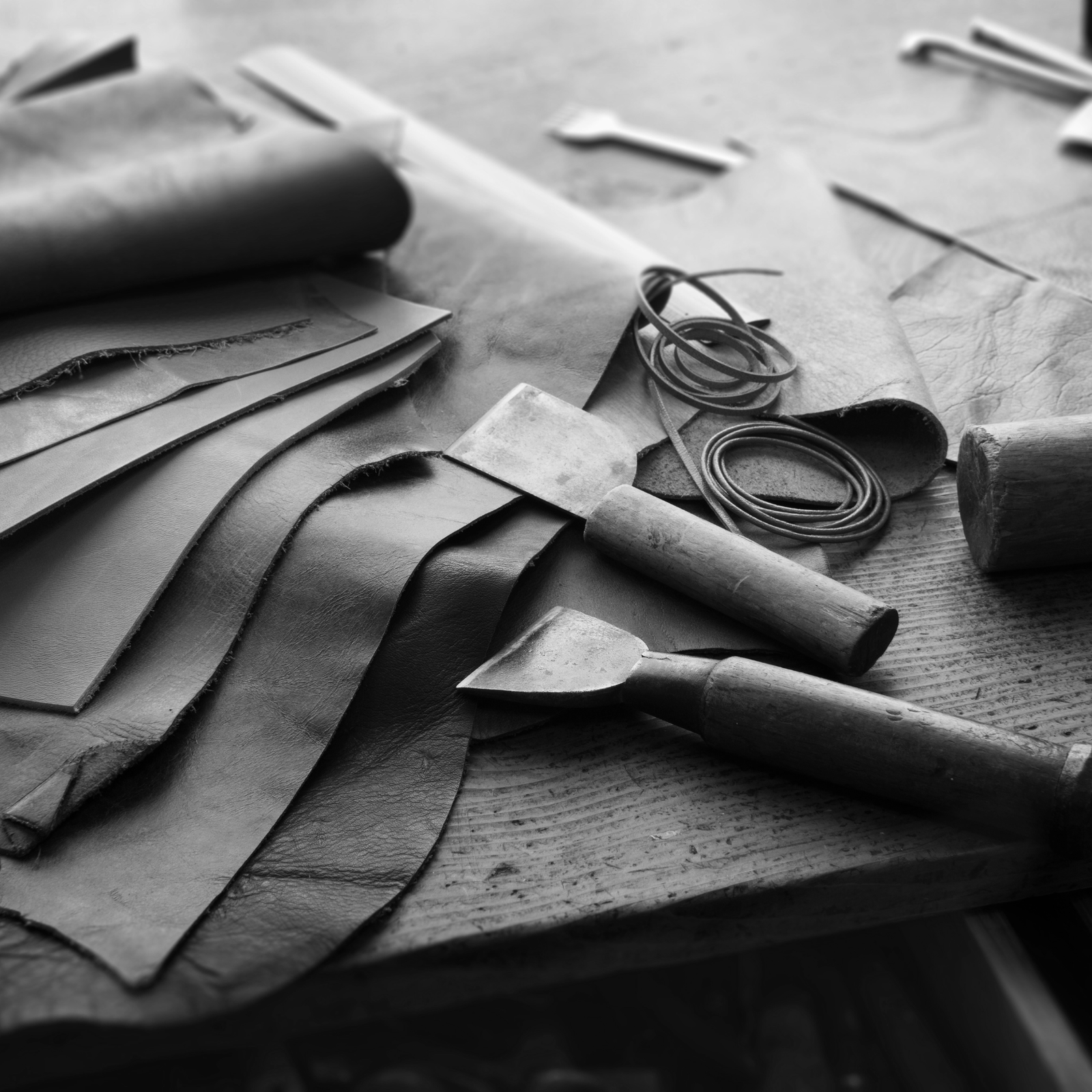 Leather swatches, sketch and tape measure used to design custom Italian heels at Giohel